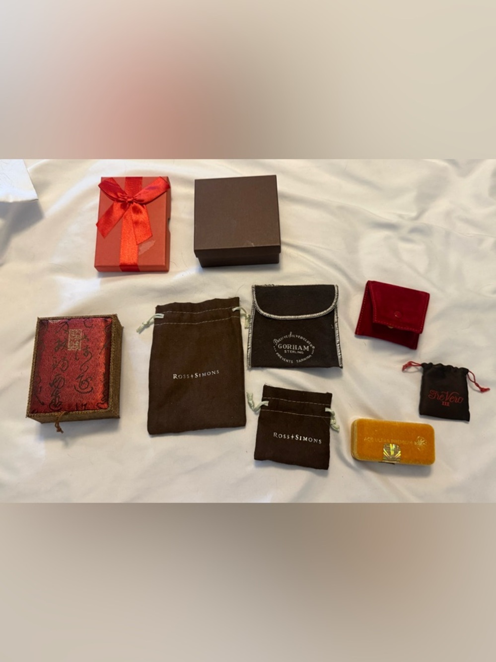 Cartier, Ross + Simmons, Gorham Sterling, Tre Vero… lot of jewelry bags & boxes.